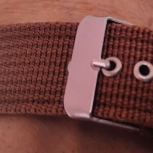 Watch with second hand and canvas band.